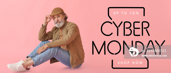 Stylish mature man with text CYBER MONDAY on pink background