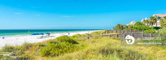 Indian rocks beach with green grass in Florida, USA
