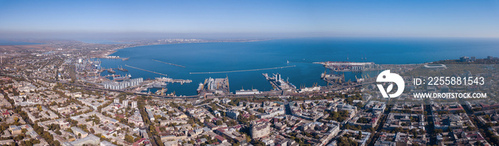 Panorama of the city of Odessa and the sea with a port against a blue sky on a sunny day. Aerial view from the drone