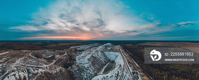 White mountains from phosphorus and gypsum wastes, industrial wastes formed mountains, business activity in Ukraine.