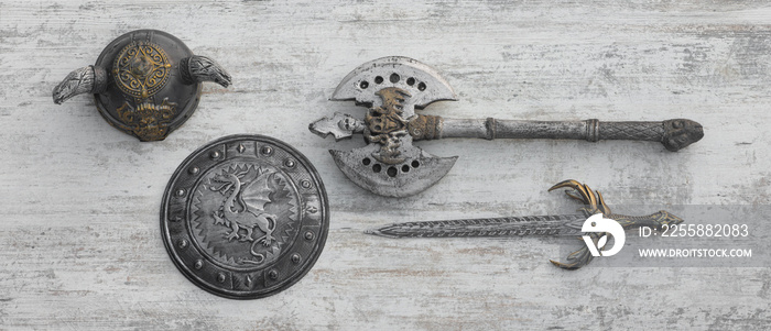 viking weapon on white wooden background