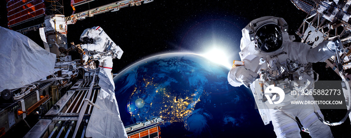 Astronaut spaceman do spacewalk while working for space station in outer space . Astronaut wear full spacesuit for space operation . Elements of this image furnished by NASA space astronaut photos.