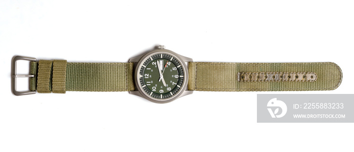 Top view military wrist watch with green nylon strap on white background.