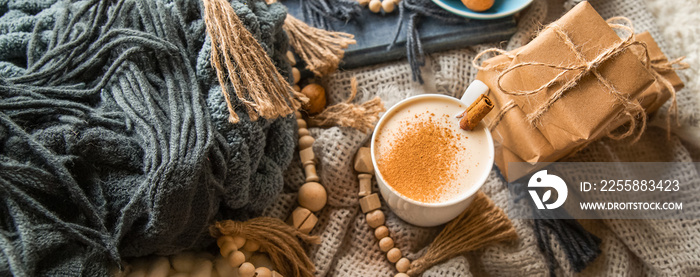 scandinavian style cozy morning with some knitted blankets, cacao mug, gift box, winter and festive mood, cristmas vibe.