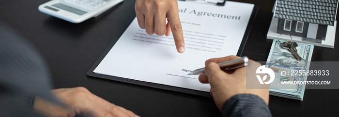 Real estate agent or sales manager has proposed terms and conditions to customers who sign house purchase agreements with insurance, Agreement to sign the purchase contract concept..