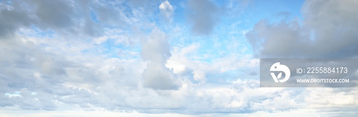 Ornamental clouds. Dramatic sky. Epic storm cloudscape. Soft sunlight. Panoramic image, texture, background, graphic resources, design, copy space. Meteorology, heaven, hope, peace concept