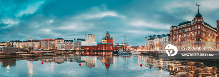 Helsinki, Finland. Panoramic View Of Pier, Embankment On Kanavaranta Street, Uspenski Cathedral And Pohjoisranta Street In Evening Illuminations