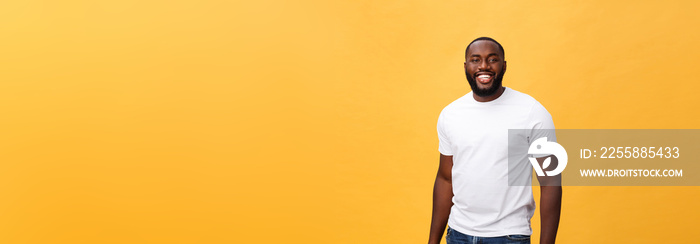 Portrait of delighted African American male with positive smile, white perfect teeth, looks happily at camera, being successful enterpreneur, wears white t shirt.