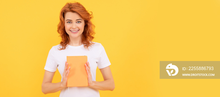 happy woman hold book on yellow background, education. Woman isolated face portrait, banner with copy space.