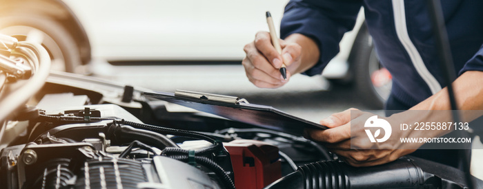 Automobile mechanic repairman hands repairing a car engine automotive workshop with a wrench, car service and maintenance,Repair service.