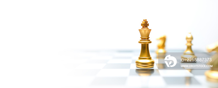 Concept of leadership. Golden king chess on the board.