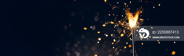 New year sparkler candle isolated on black background