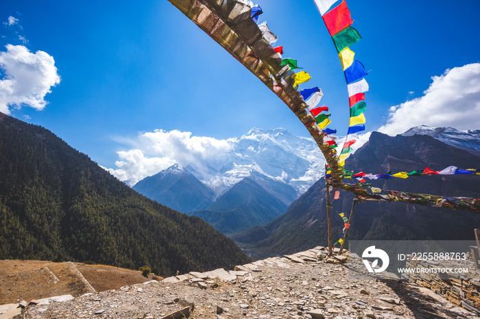 Buddhist flags.  Annapurna circuit trek. Himalayan mountains, Nepal.