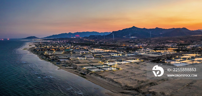 Aerial view of the prawn farm with aerator pump in front of Ninh Phuoc, Ninh Thuan, Vietnam. The growing aquaculture business continuously threatening the nearby wetlands.