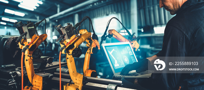 Smart industry robot arms for digital factory production technology showing automation manufacturing process of the Industry 4.0 or 4th industrial revolution and IOT software to control operation .