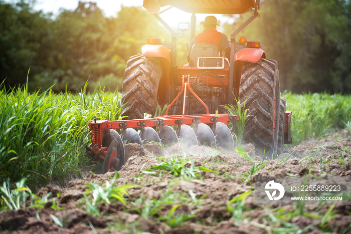 Agricultural workers and tractors, tillage machines, tillage and plowing for farming in Asia