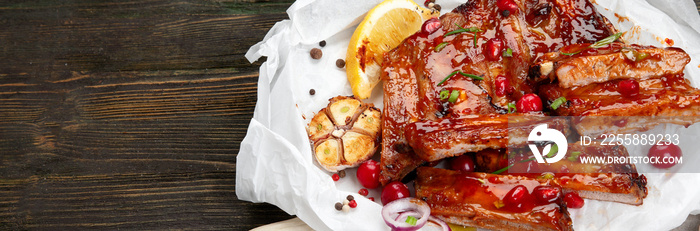 Delicious marinated grilled barbecue spare ribs with different sauces