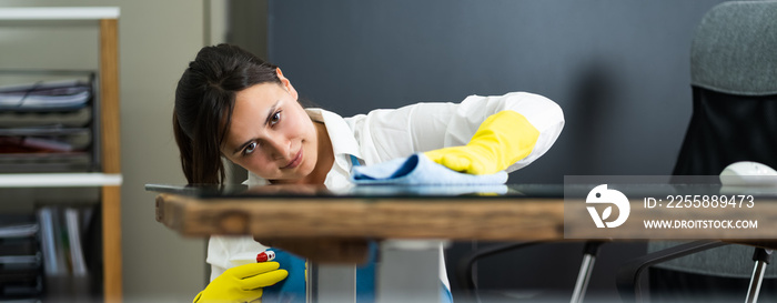 Janitor Cleaning Office Desk