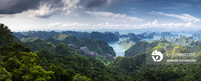 scenic view over Ha Long bay from Cat Ba island, Ha Long city in the background, UNESCO world heritage site, Vietnam