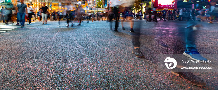 Pedestrians cross the Shibuya Scramble crosswalk in Tokyo, Japan, one of the busiest intersections in the world