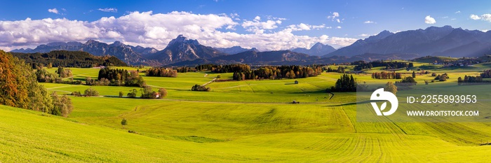 panoramic landscape in Bavaria with mountain range and lake