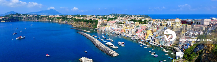 Beautiful island town in Italy. Panoramic aerial view overlooking the harbor and pastel buildings of Procida.