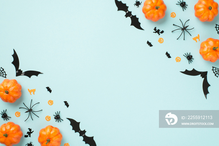 Top view photo of halloween decorations pumpkins spiders cobweb cat witch and bats silhouettes on is