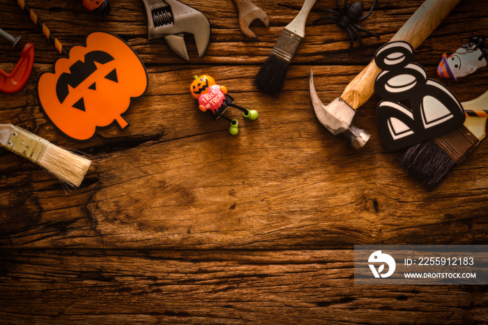 Happy Halloween day with construction DIY handy tools on grunge wood background concept. Flat lay To