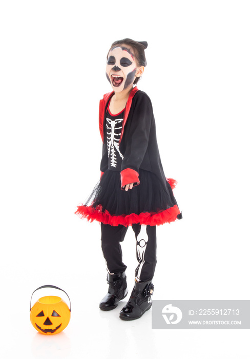 Portrait adorable Asian young girl dress skeleton and witch costume with black hat isolated backgrou