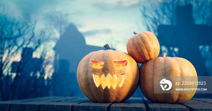 Halloween pumpkin glowing on gothic graveyard.