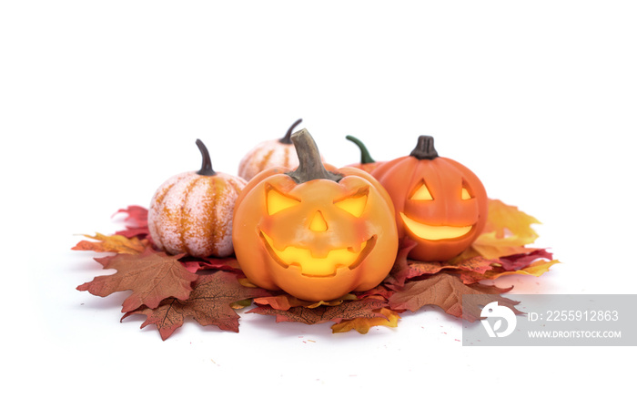 Halloween trick or treat. Pumpkin head Jack-o-lantern glowing with burning candles on a pile of map