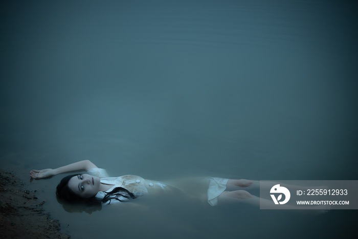 Portrait of asian woman make up ghost face at the swamp,Horror scene,Scary background,Halloween post