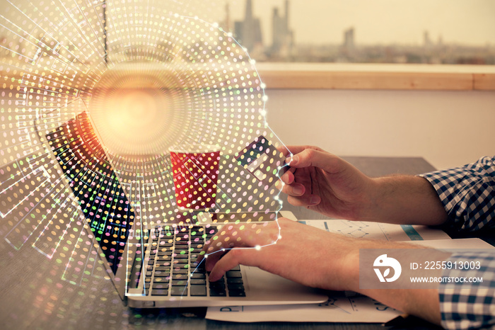 Double exposure of man hands typing on computer with credit card and brain theme drawing. E-commerce