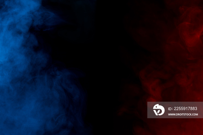 a cloud of blue and red cigarette vapor on a dark background are like a mystical night fog