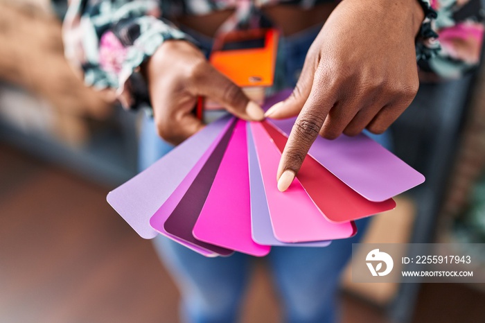 African american woman ecommerce business worker choosing color at office