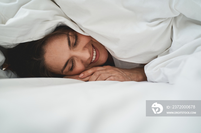 Beautiful lady with a happy smile napping peacefully