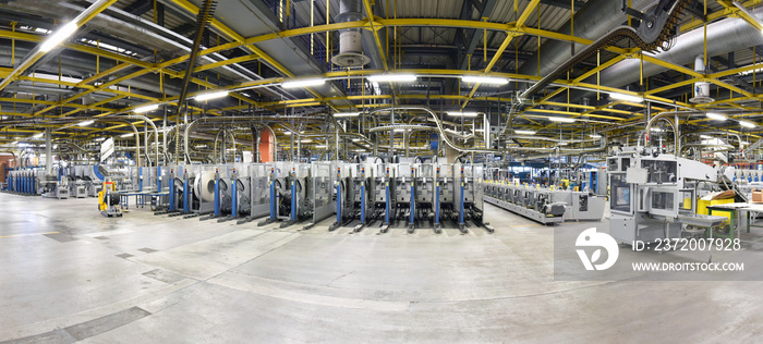 modern machines for transportation in a large print shop for production of newspapers & magazines