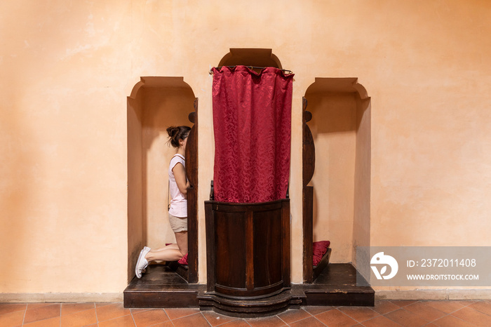 woman in the confessional on church