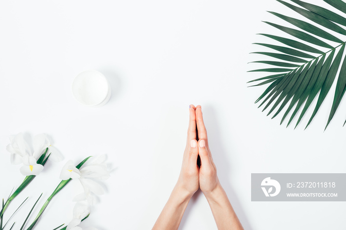 Top view of female hands doing namaste gesture