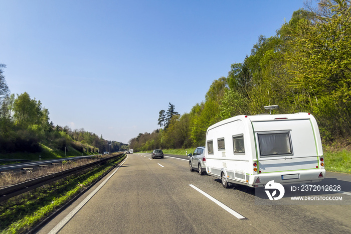 Caravan or recreational vehicle motor home trailer on a freeway road