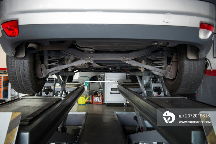 view of the underside of a car in the garage