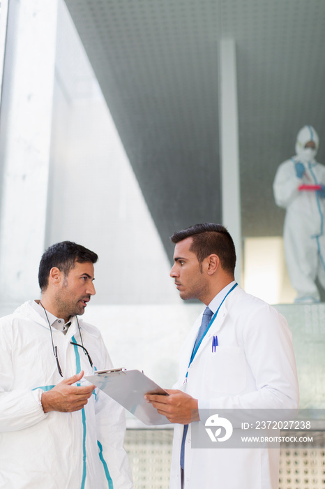 Biochemists with clipboard talking