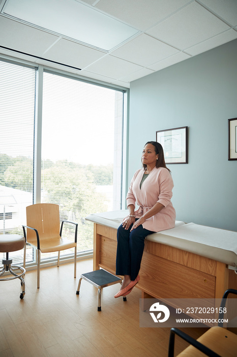 Woman waiting in examination room