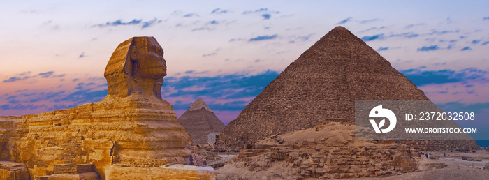 Sphinx against the backdrop of the great Egyptian pyramids. Africa, Giza Plateau.