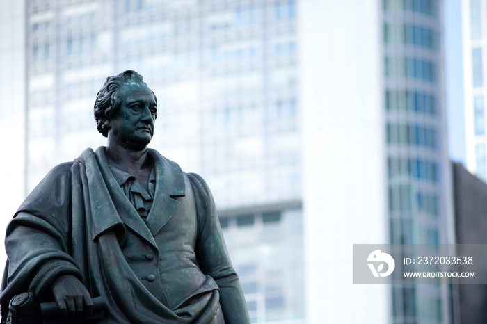 Goethe statue at Goetheplatz in Frankfurt with skyscraper