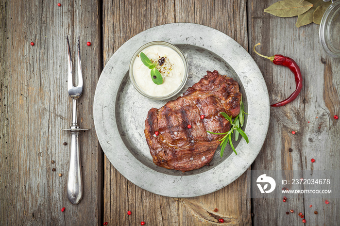 Tenderloin steak on plate with sauce