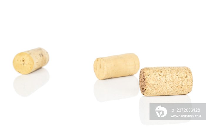 Group of three whole common wine cork isolated on white background