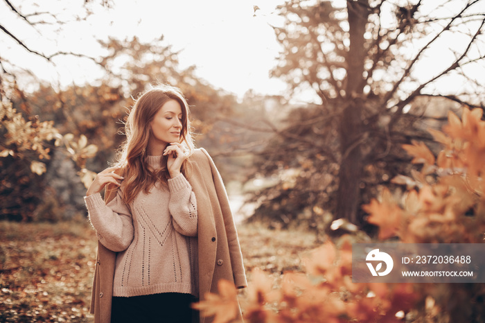 Beautiful girl in autumn park