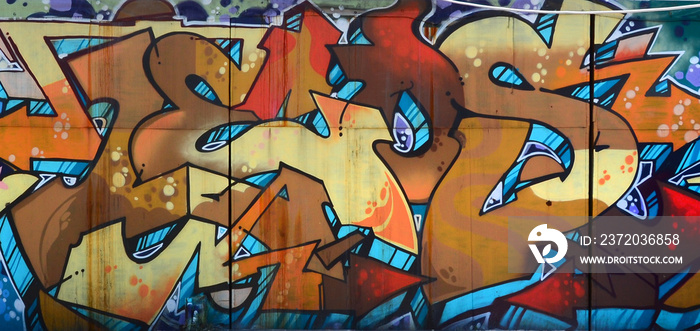 Street art. Abstract background image of a full completed graffiti painting in beige and orange tone