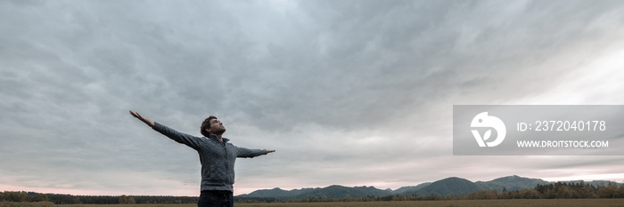 Wide view image of young man celebrating life